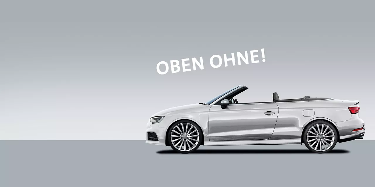 silbernes-audi-a3-cabrio-vor-grauem-hintergrund-mit-schriftzug-oben-ohne-dadrüber