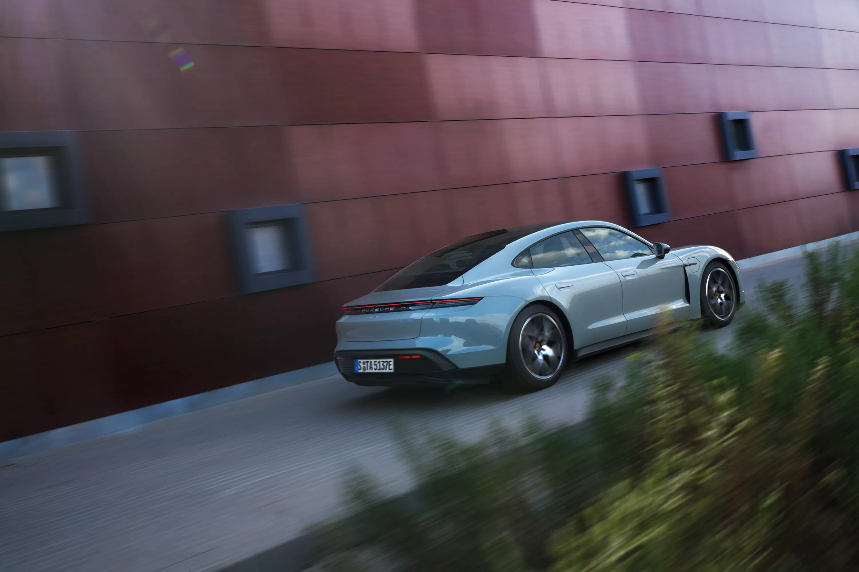 Porsche beside building 