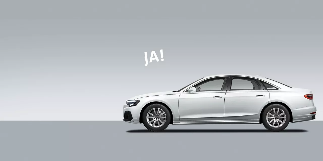 audi-a8-steht-vor-grauem-hintergrund-mit-schriftzug-ja-dadrüber